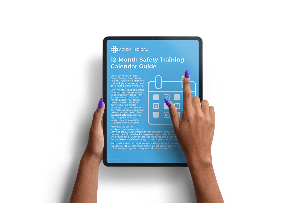 Hands hold a tablet, scrolling through the Axiom Medical12 Month Safety Training Guide 